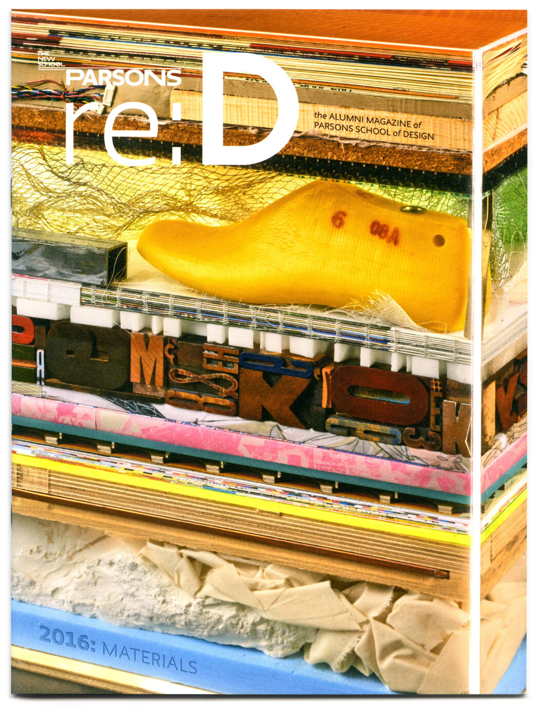 Cover of ReD Magazine showing a stack of various materials from around Parsons