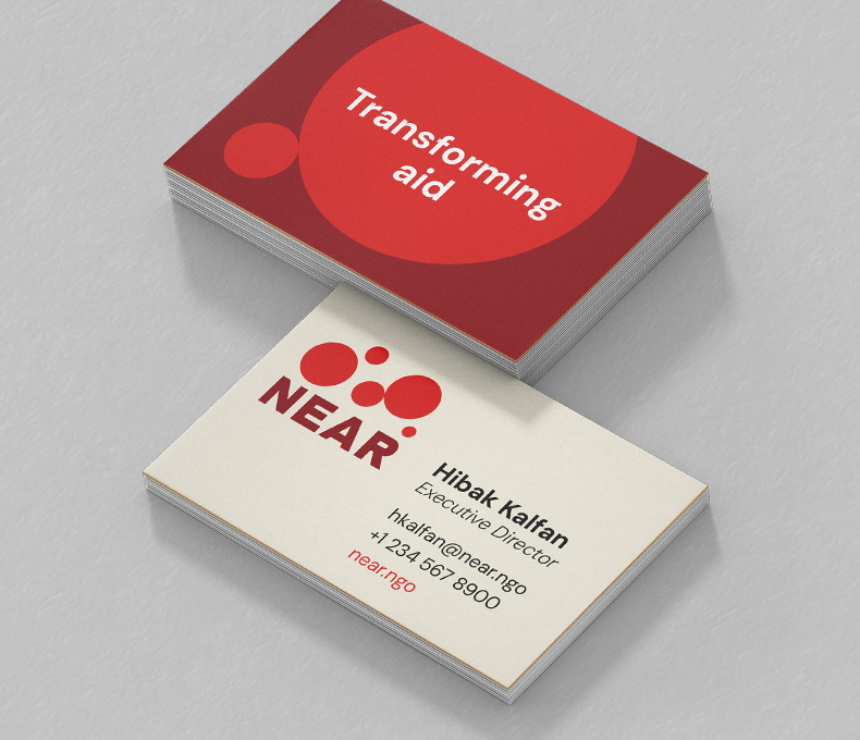 Two stacks of business cards